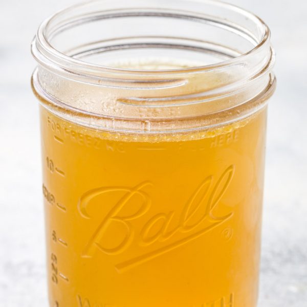 homemade chicken broth in a mason jar