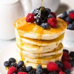 gluten free pancakes with syrup and berrie