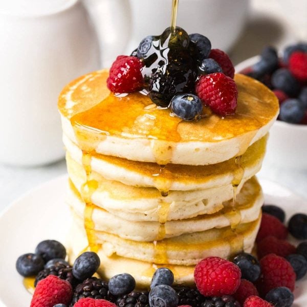 gluten free pancakes with syrup and berrie