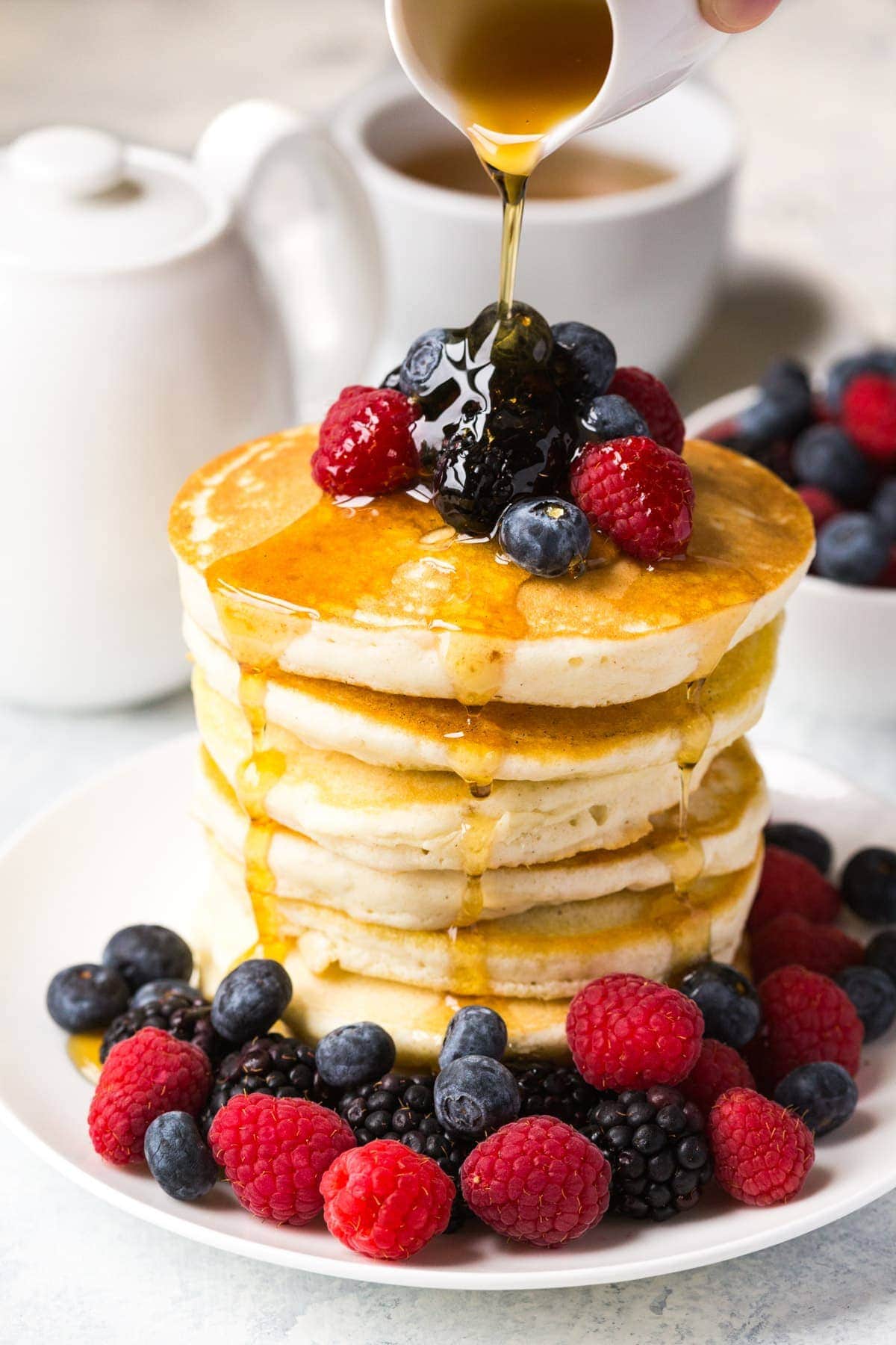 gluten free pancakes with syrup and berrie