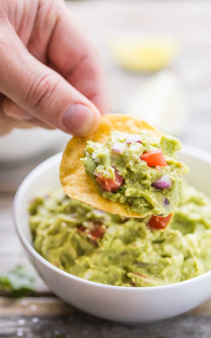 Quick and easy Guacamole, SO much tastier store bought! Gluten Free, dairy free, vegan, vegetarian, paleo, primal, and Whole 30 compliant.
