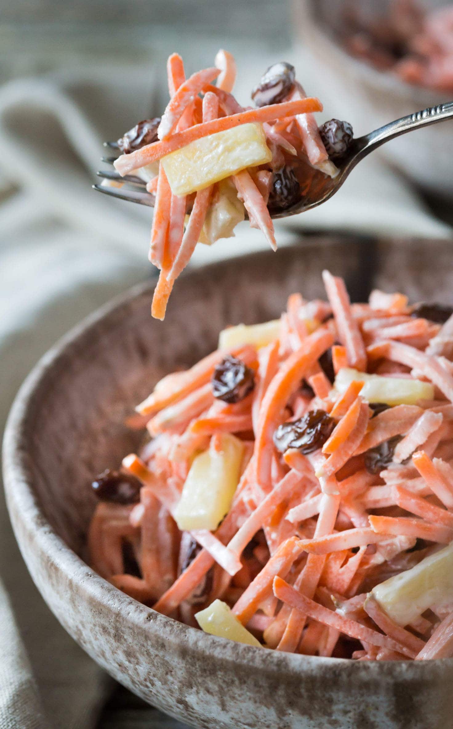 A very easy nutritious Paleo, Whole 30, and Gluten Free Carrot Raisin Pineapple Salad that requires no cooking and can be made in just a few minutes! It's vegetarian and you can make it vegan with a mayonnaise substitute.