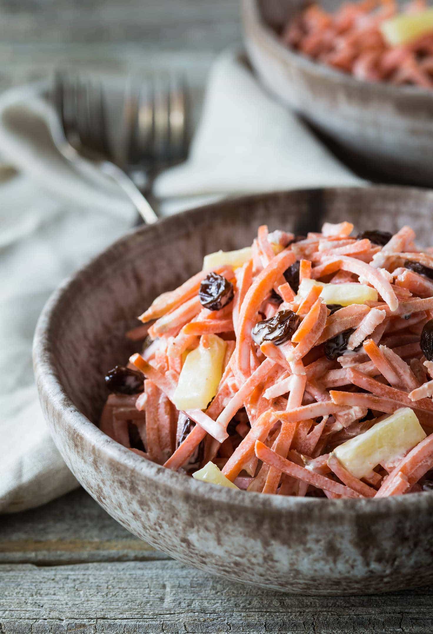 A very easy nutritious Paleo, Whole 30, and Gluten Free Carrot Raisin Pineapple Salad that requires no cooking and can be made in just a few minutes! It's vegetarian and you can make it vegan with a mayonnaise substitute.