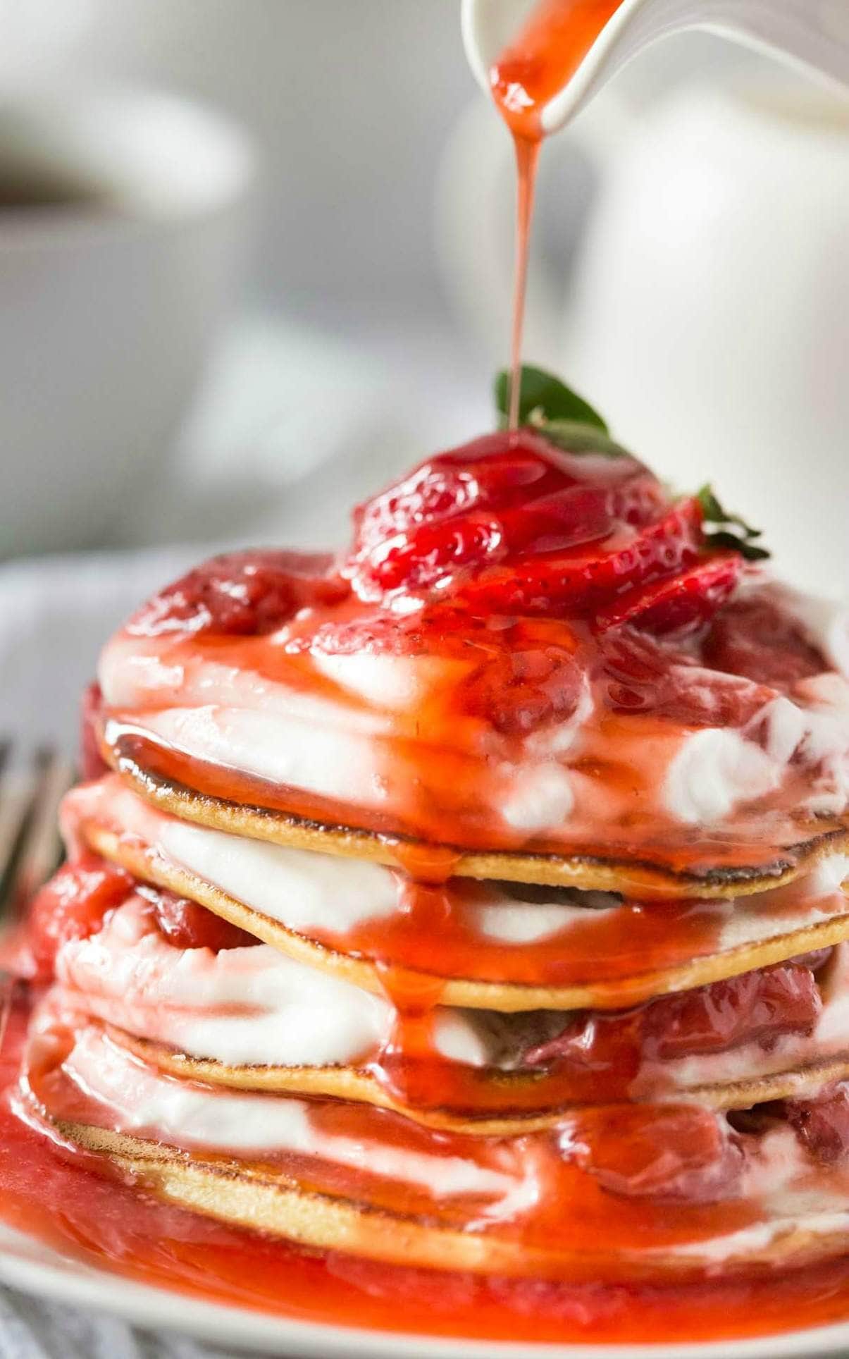 Delicious Low Carb Paleo Crepes with Strawberry sauce and Coconut Whipped Cream made in 15 minutes! Dairy Free, Gluten Free, Paleo and Grain Free.