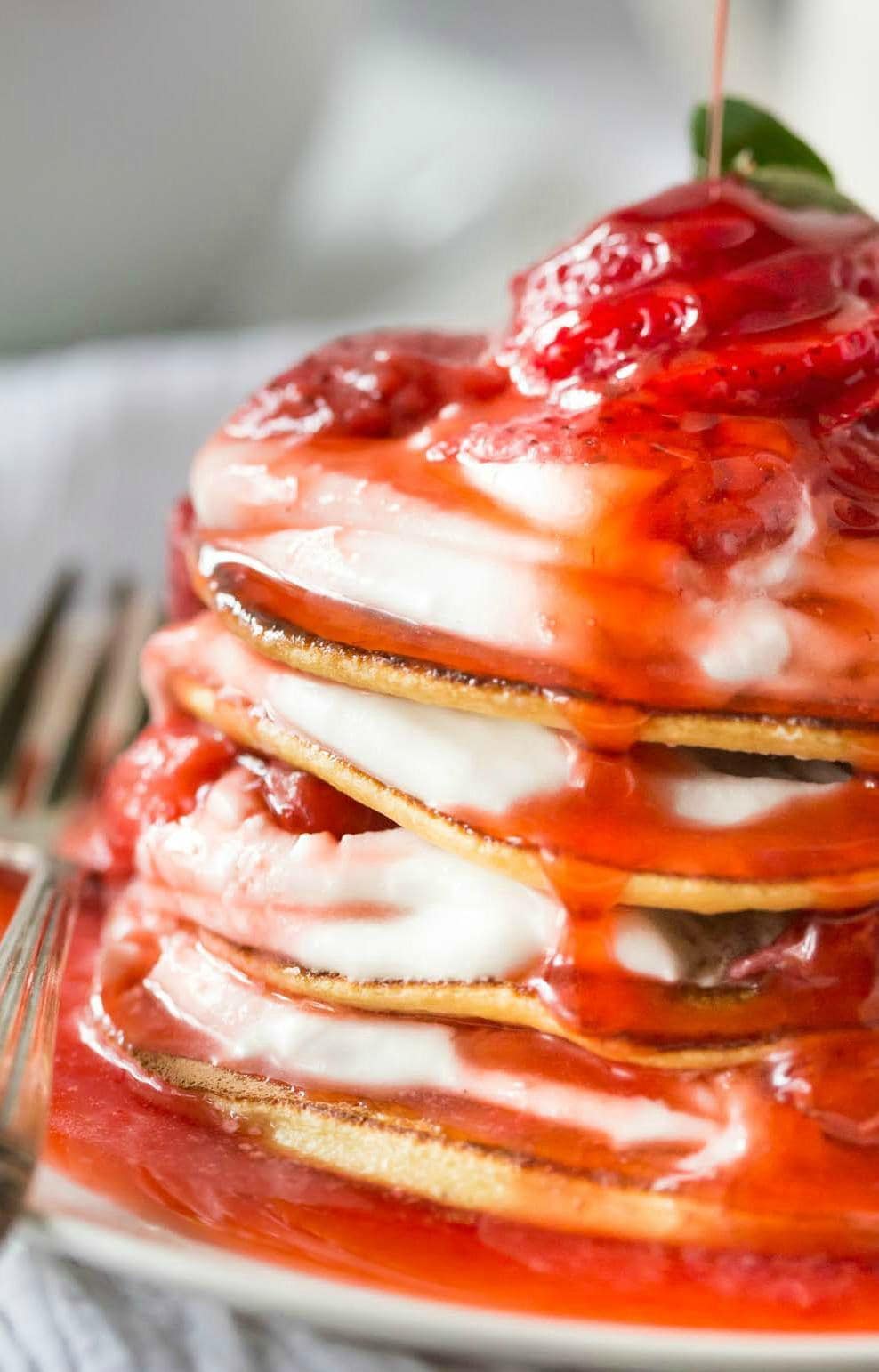Delicious Low Carb Paleo Crepes with Strawberry sauce and Coconut Whipped Cream made in 15 minutes! Dairy Free, Gluten Free, Paleo and Grain Free.