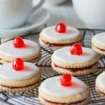 Delectable Scottish Gluten Free Empire Biscuits are tasty little shortbread cookies sandwiched together with jam and iced on the top, perfect with a nice cup of tea!