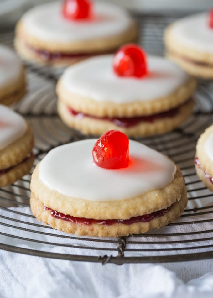 Delectable Scottish Gluten Free Empire Biscuits are tasty little shortbread cookies sandwiched together with jam and iced on the top, perfect with a nice cup of tea!