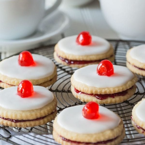 Delectable Scottish Gluten Free Empire Biscuits are tasty little shortbread cookies sandwiched together with jam and iced on the top, perfect with a nice cup of tea!