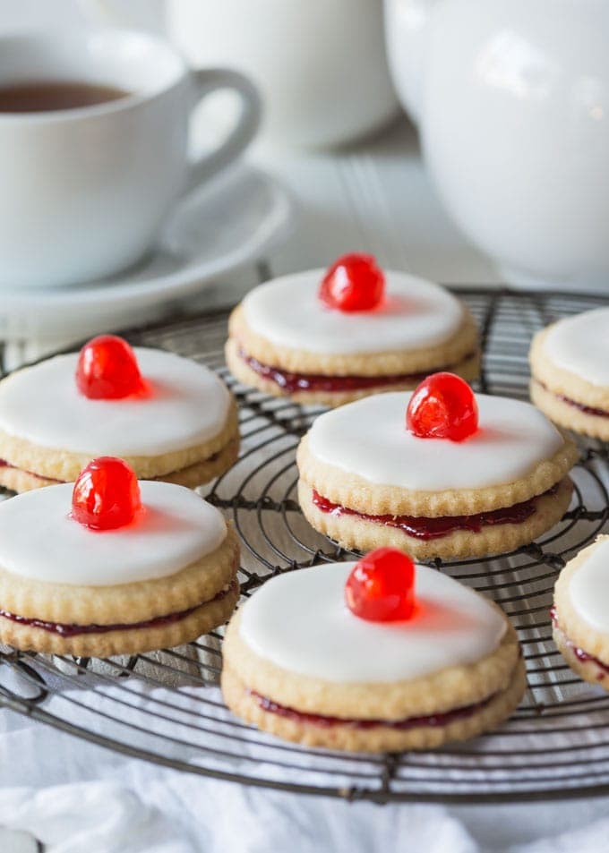 Delectable Scottish Gluten Free Empire Biscuits are tasty little shortbread cookies sandwiched together with jam and iced on the top, perfect with a nice cup of tea!