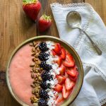 A nutrient dense Strawberry Pineapple Smoothie Bowl that's a perfect way to start your day! It's Vegan, Gluten Free, Paleo and Whole30 compliant.