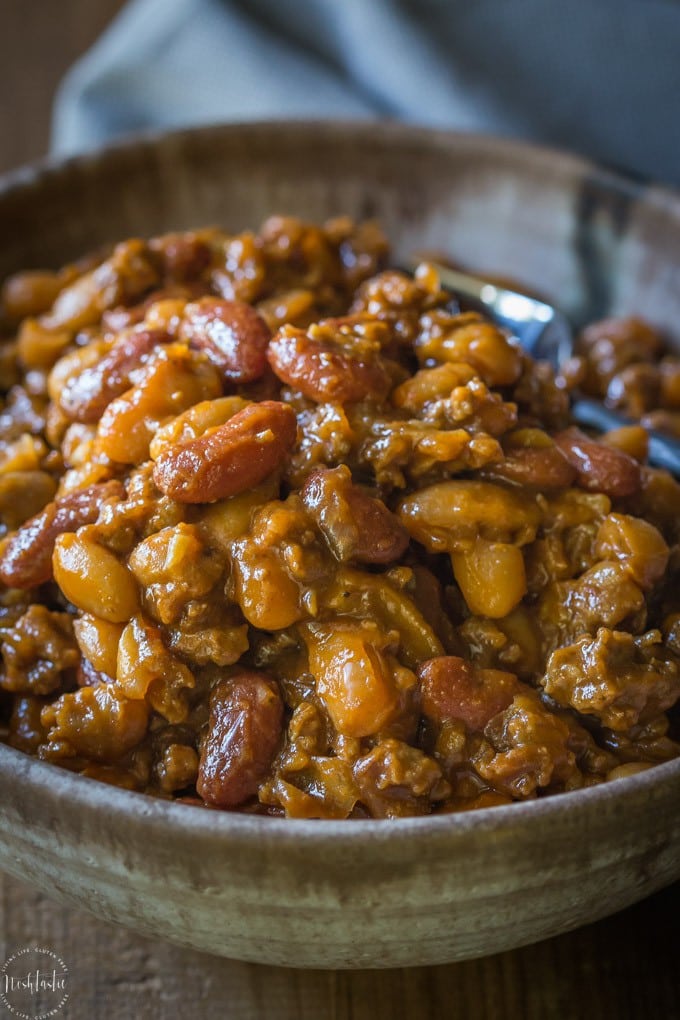 Best BBQ Baked Beans with Beef, this is hands down the most popular recipe I've made all year, so, so tasty! Also known as Cowboy Beans or Southern Baked Beans | gluten free and dairy free | from noshtastic.com