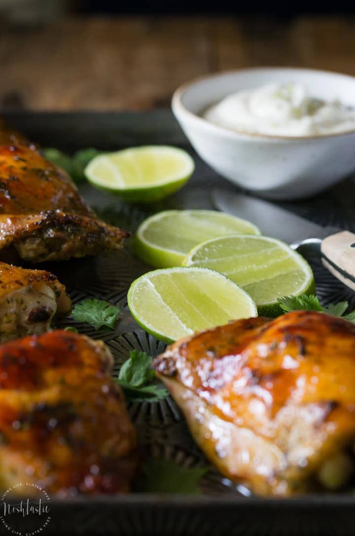 Crispy Baked Cilantro Lime Chicken with Garlic! Paleo and Whole 30 option. Made with a Cilantro, Honey, Allspice, Lime, Chili Flakes and Garlic marinade.