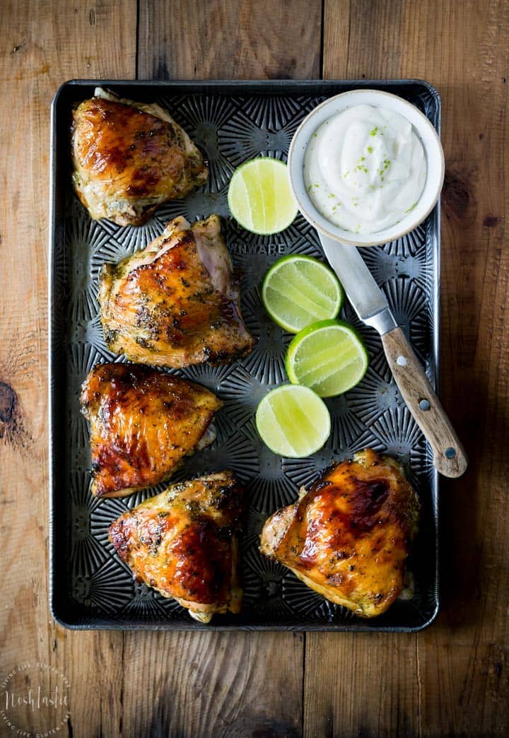 Easy Baked Cilantro Lime Chicken with Garlic! Made with a Cilantro, Honey, Allspice, Lime, Chili Flakes and Garlic marinade, this is a Paleo recipe with a Whole 30 option.