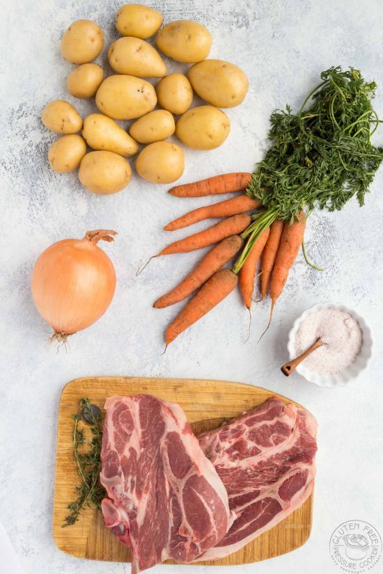 meat and vegetables on a table for making irish stew