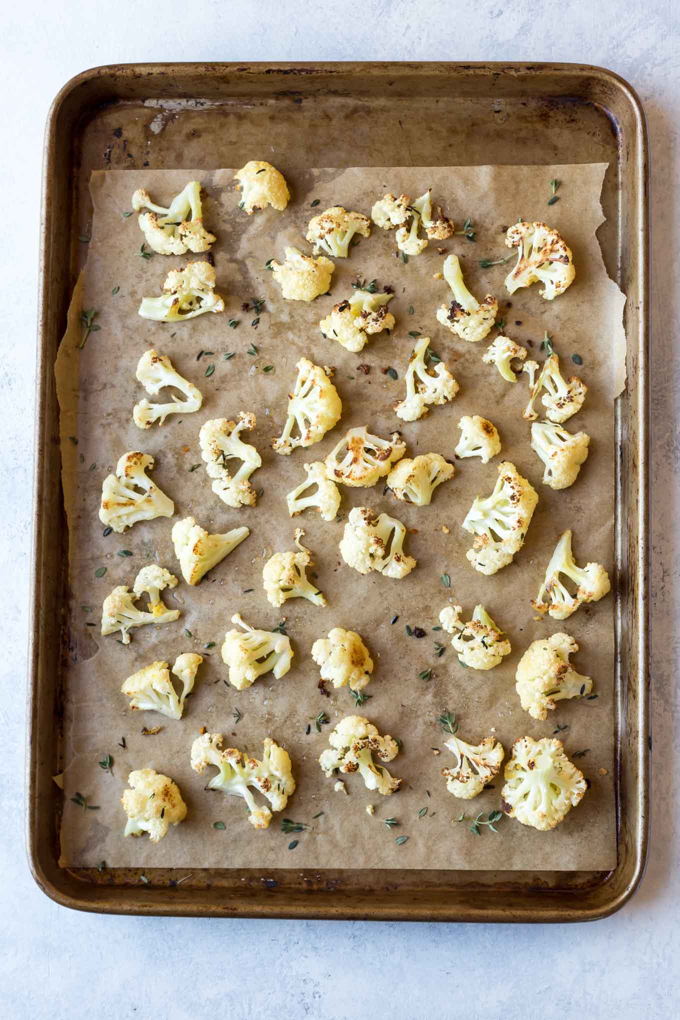 Paleo Roasted Cauliflower with Lemon,Thyme, and Garlic, make it easily in the oven! This recipe is also Whole30, vegan and low carb.