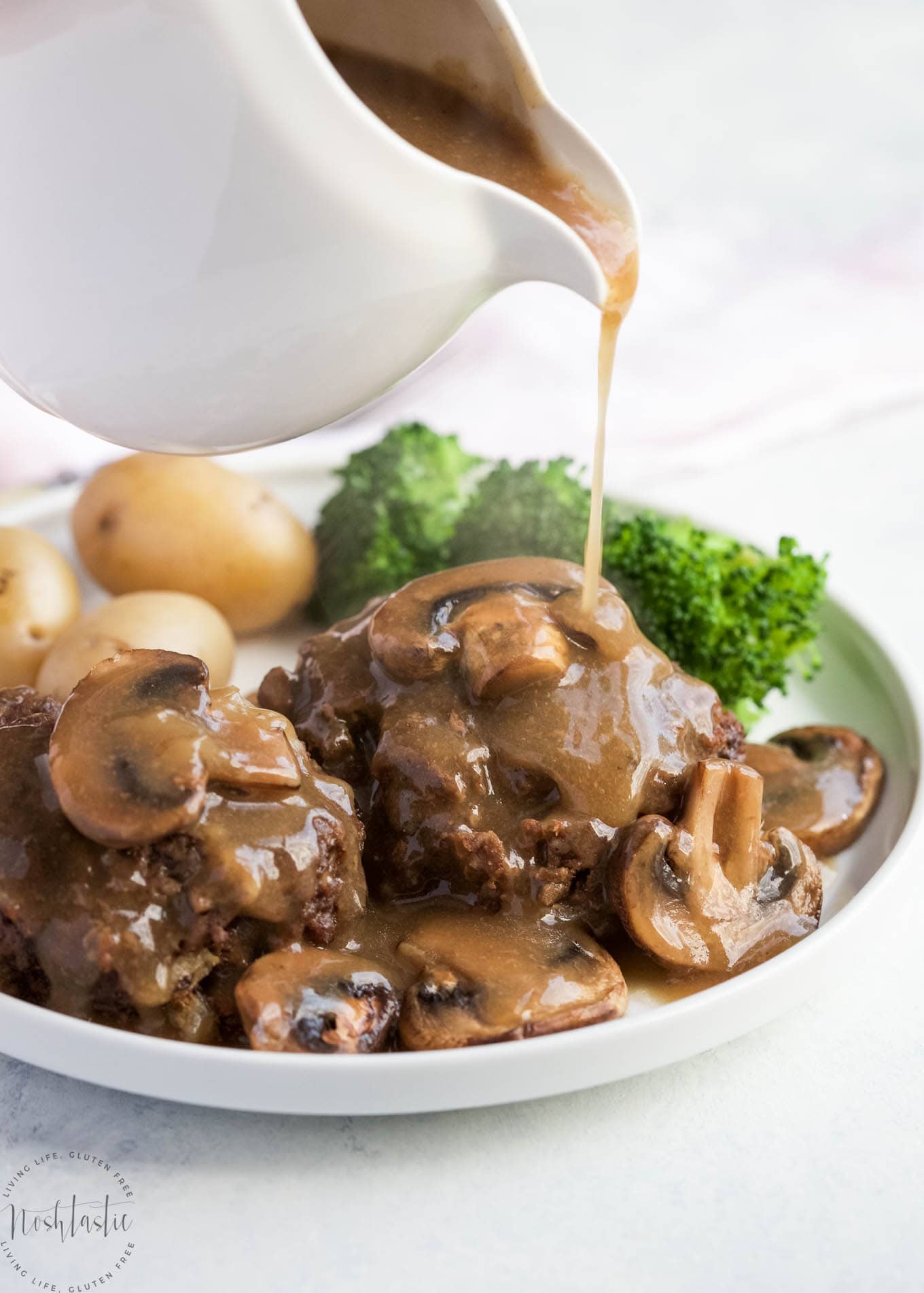 You'll love my gluten free Instant Pot Salisbury Steak with Mushroom Gravy recipe! It's a really easy weeknight pressure cooker meal that's also gluten and dairy free. Made with ground beef and mushrooms, potatoes optional.