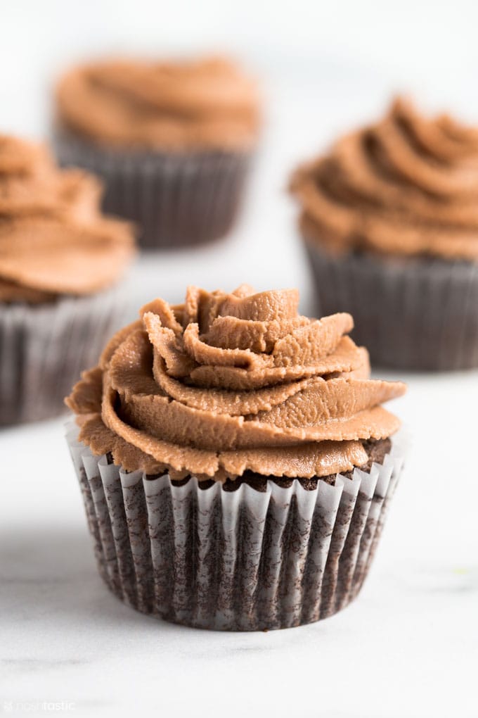 gluten free chocolate cupcake with chocolate frosting on a table