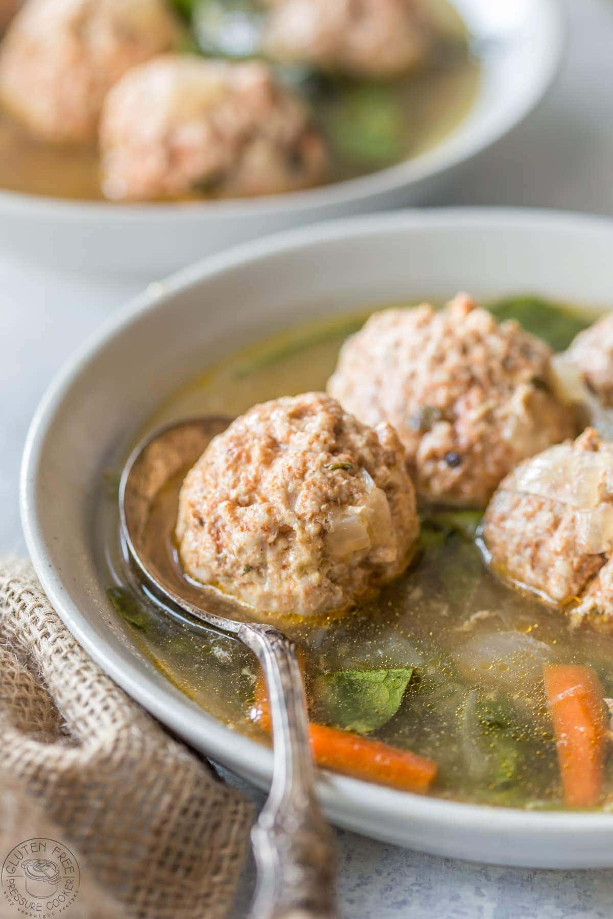 Pressure Cooker Italian Wedding Soup, this recipe is gluten free, paleo, Whole30, low carb and healthy, and is perfect to make in your Instant Pot or any other electric pressure cooker!