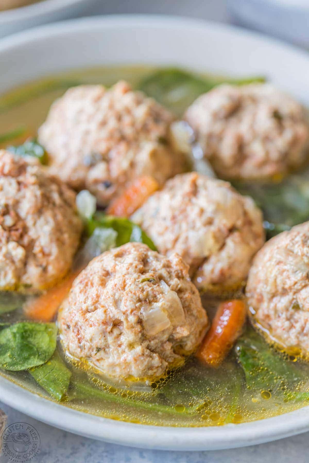 Pressure Cooker Italian Wedding Soup, this recipe is gluten free, paleo, Whole30, low carb and healthy, and is perfect to make in your Instant Pot or any other electric pressure cooker!