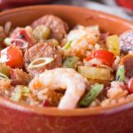 You can make this authentic homemade Creole Jambalaya Recipe really quickly on your stovetop, it's flavor packed with bell peppers, celery, onions, spices, chicken and shrimp, you'll love it! This recipe is healthy, made from scratch, gluten free and dairy free too.