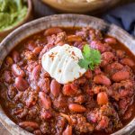 bowl of instant pot chili with sour cream on top