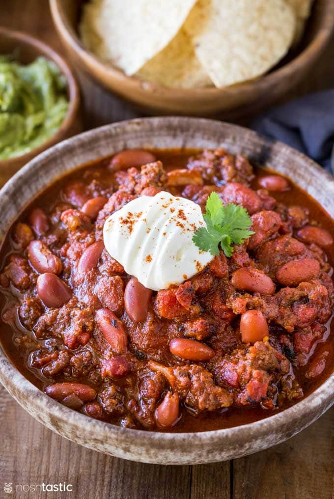 bowl of instant pot chili with sour cream on top