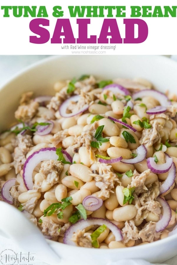Tuna White Bean Salad with Red Wine vinaigrette dressing, and no mayo! It's packed full of protein and contains, tuna, white beans and fresh parsley. A really healthy, gluten free, low calorie lunch or dinner option, this salad is ready to eat in less than 5 Minutes! dairy free, egg free, gluten free www.noshtastic.com #glutenfreesalad #healthysalad #tunasalad #whitebeansalad #tuna #cleaneating #healthyeating