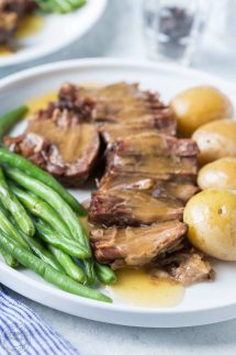 Now you can cook a classic pot roast in your electric pressure cooker in less than an hour! This easy recipe makes a really easy, healthy weeknight meal! It's gluten free, paleo and whole 30, low carb, and healthy!