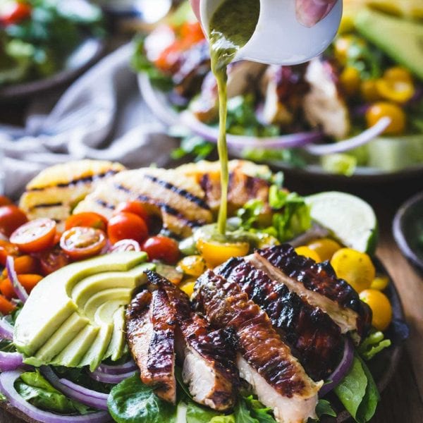 Cilantro Lime Chicken Salad with dressing being poured on top