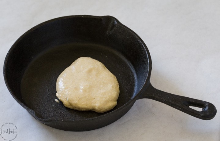 paleo pancakes cooking in skillet