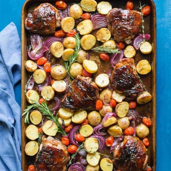 You need to try my delicious, easy, sheet pan Paleo Balsamic Chicken recipe with Roasted Potatoes, Red Onion, Tomatoes & fresh herbs! You can cook it on one pan in the oven in an hour or less!