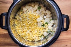 sweetcorn and potatoes in a pressure cooker