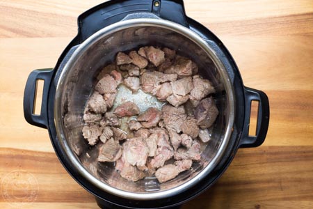 step by step guide to pressure cooker beef bourguignon - step one