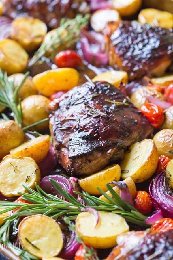 You need to try my delicious, easy, sheet pan Paleo Balsamic Chicken recipe with Roasted Potatoes, Red Onion, Tomatoes & fresh herbs! You can cook it on one pan in the oven in an hour or less!