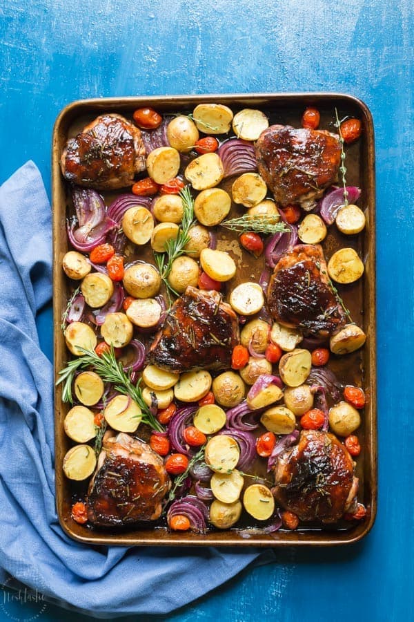 You need to try my delicious, easy, sheet pan Paleo Balsamic Chicken recipe with Roasted Potatoes, Red Onion, Tomatoes & fresh herbs! You can cook it on one pan in the oven in an hour or less.