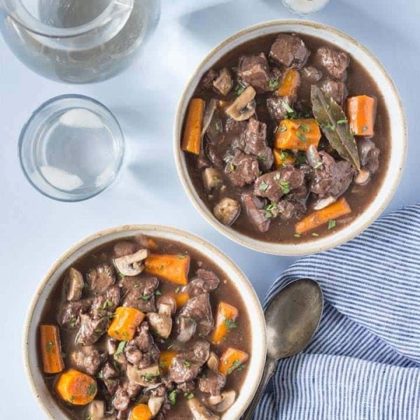 Pressure Cooker Beef Bourguignon recipe made with beef, onions, garlic, mushrooms and red wine. Also known as Beef Burgundy. You can cook this in your electric pressure cooker or instant pot. It's gluten free and can be made paleo or whole30.
