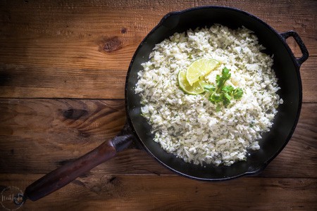 Cauliflower Cilantro Lime Rice is a fantastic substitute for real rice, it has way less calories and is perfect for people on a low carb or ketogenic diet. #keto #ketogenicdiet #lowcarb #cauliflowerrice #paleo #whole30 #glutenfree #cilantro #lime #lowcalorie #castironskillet