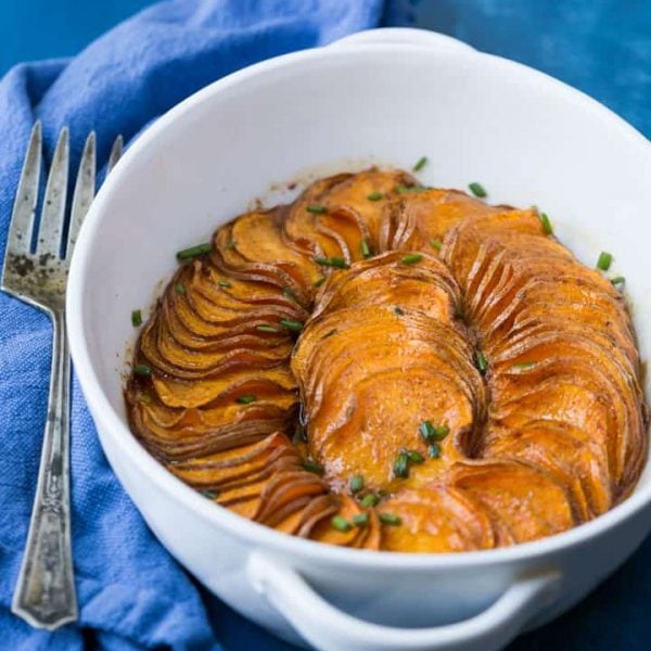 A gorgeous Paleo Scalloped Sweet Potato recipe that's both quick and easy to make, tastes great, and looks fantastic! It's perfect for your Thanksgiving table. #paleo #paleosweetpotatoes #paleothanksgiving #paleosides #paleodinner #paleorecipe #glutenfreethanksgiving #maplesyrup