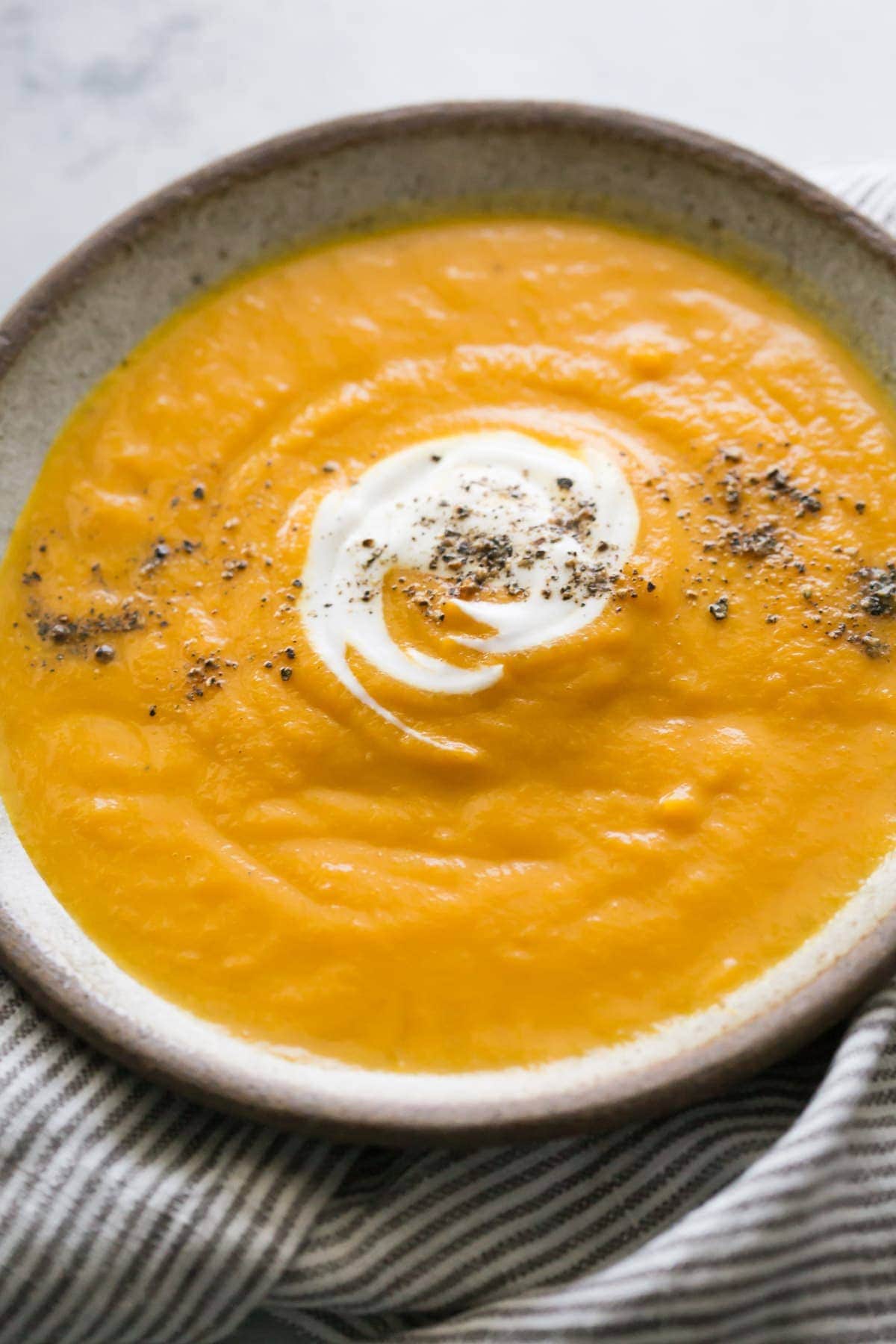 Carrot and coriander soup recipe | www.noshtastic.com | #carrotsoup #carrotandcoriandersoup #britishfood #britishrecipes #glutenfree #noshtastic #glutenfreerecipe #paleosoup #whole30soup #paleo #whole30