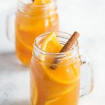 Perfect Hot Apple Cider spiced up with cinnamon, clove, ginger, oranges and lemon, this is a very easy hot mulled apple cider recipe to make and it's perfect for the holidays! #hotapplecider #mulledcider #applecider #hotcider #glutenfree #noshtastic