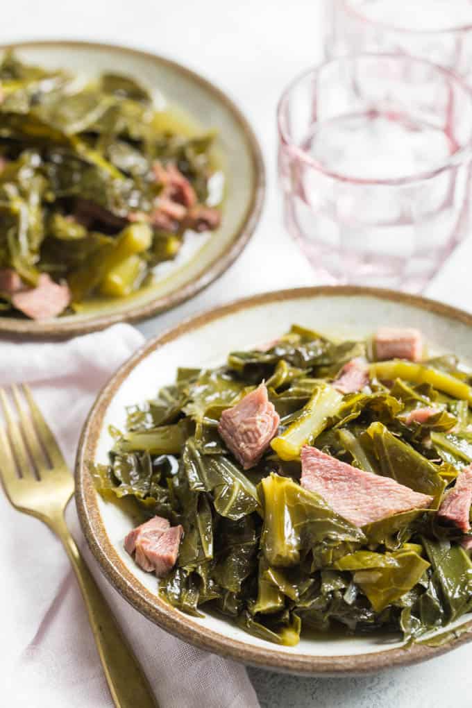 Pressure Cooker Collard Greens made in a fraction of the time in your pressure cooker or Instant Pot! Cooked with a smoked turkey leg and makes the most amazing 'pot likker' or pot liquor #instantpot #instapot #collardgreens #southernfood #soulfood #electricpressurecooker #glutenfreepressurecooker #glutenfreeinstantpot #glutenfree 