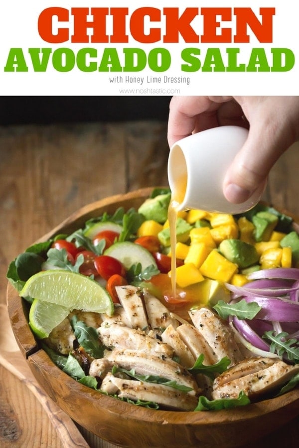 Chicken Avocado Salad with Honey Lime Dressing is such a fun summer salad! It's jam packed with healthy ingredients including arugula, spinach, and mango.| www.noshtastic.com | #chickensalad #chickenavocadosalad #glutenfreesalad #paleo #paleosalad #paleochicken #healthysalad #glutenfree #noshtastic #glutenfreerecipe