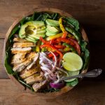 My Chicken Fajita Salad has all kinds of tasty ingredients including, grilled marinated fajita chicken, red onions, bell pepper, avocados and is topped with a fabulous honey lime salad dressing.| www.noshtastic.com | #chickenfajitas #chickenfajitasalad #fajitasalad #chickensalad #paleo #paleosalad #paleochicken #healthysalad #glutenfree #noshtastic #glutenfreerecipe