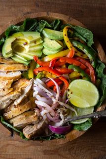 My Chicken Fajita Salad has all kinds of tasty ingredients including, grilled marinated fajita chicken, red onions, bell pepper, avocados and is topped with a fabulous honey lime salad dressing.| www.noshtastic.com | #chickenfajitas #chickenfajitasalad #fajitasalad #chickensalad #paleo #paleosalad #paleochicken #healthysalad #glutenfree #noshtastic #glutenfreerecipe