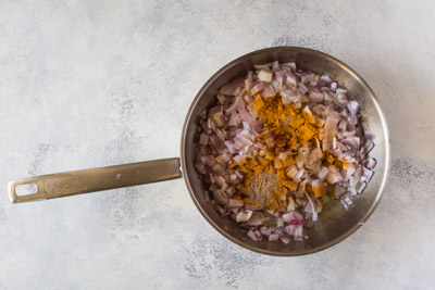 onions and spices in a pan
