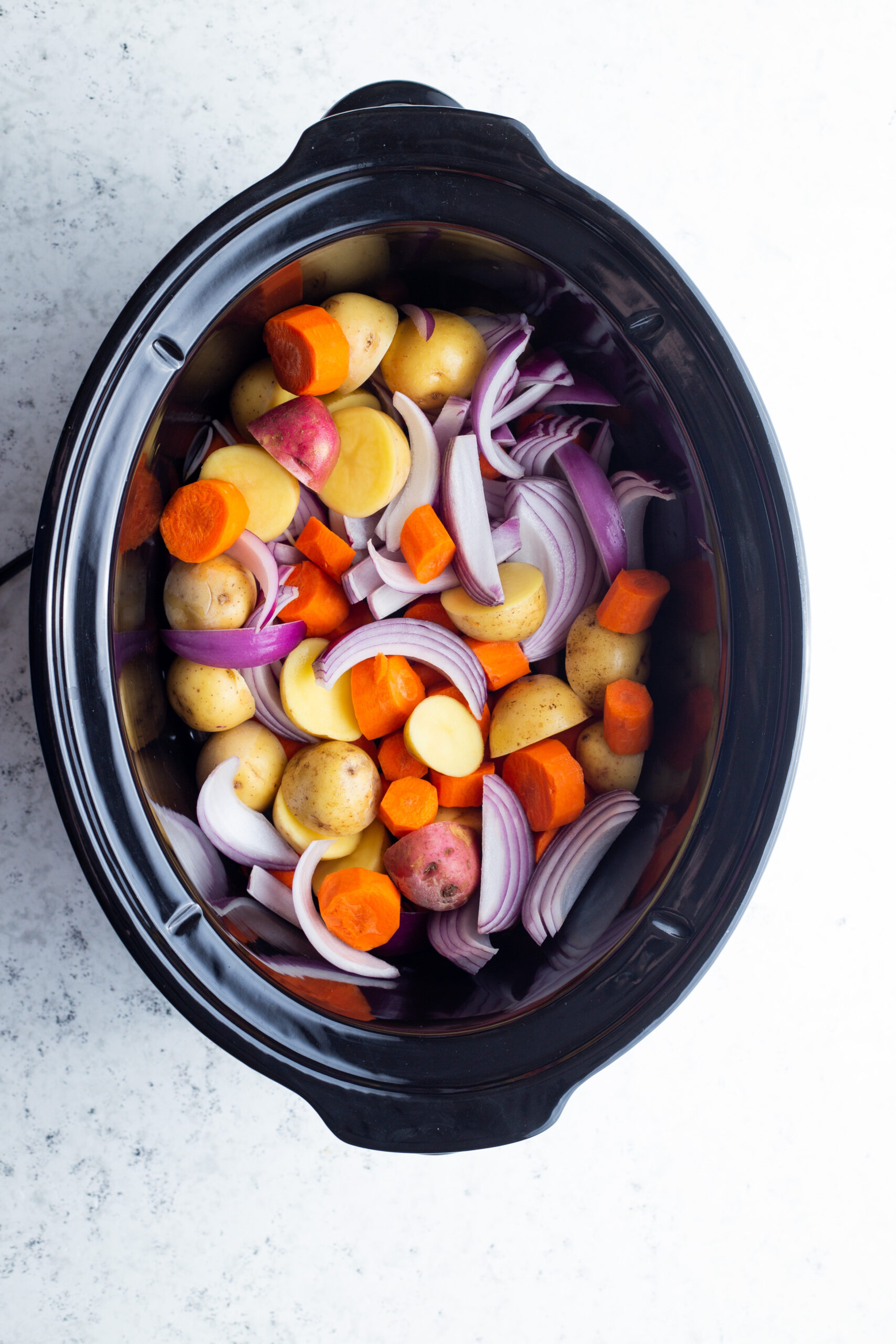 ingredients for stew in a slow cooker