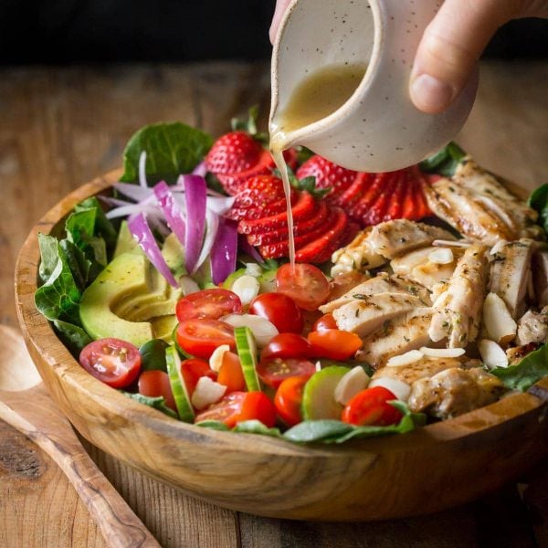 My Grilled Chicken Salad has all sorts of fabulous ingredients including, chicken marinated in garlic and fresh thyme, strawberries, almonds and is topped with an apple cider vinaigrette dressing. | www.noshtastic.com | #grilledchickensalad #chickensalad #grilledchicken #paleochickensalad #paleochicken #paleosalad #glutenfreesalad #glutenfree #noshtastic #glutenfreerecipe