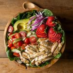 My Grilled Chicken Salad has all sorts of fabulous ingredients including, chicken marinated in garlic and fresh thyme, strawberries, almonds and is topped with an apple cider vinaigrette dressing. | www.noshtastic.com | #grilledchickensalad #chickensalad #grilledchicken #paleochickensalad #paleochicken #paleosalad #glutenfreesalad #glutenfree #noshtastic #glutenfreerecipe