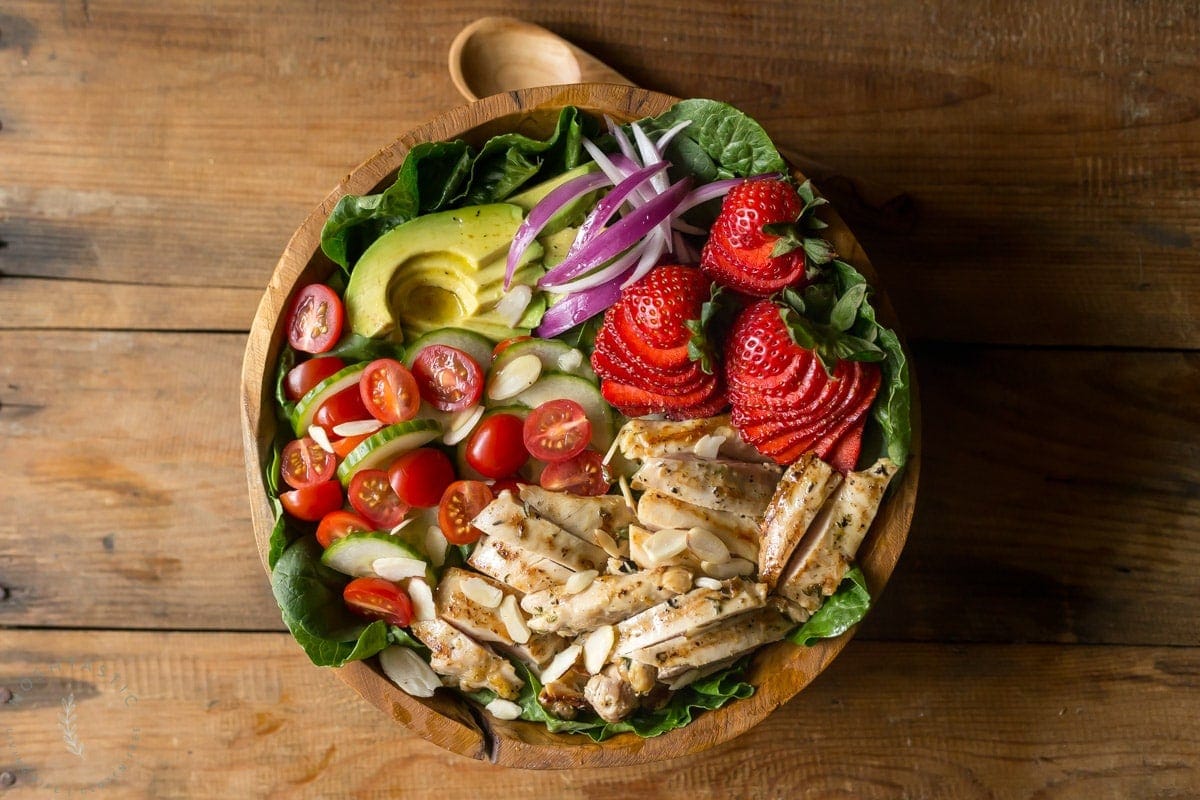My Grilled Chicken Salad has all sorts of fabulous ingredients including, chicken marinated in garlic and fresh thyme, strawberries, almonds and is topped with an apple cider vinaigrette dressing. | www.noshtastic.com | #grilledchickensalad #chickensalad #grilledchicken #paleochickensalad #paleochicken #paleosalad #glutenfreesalad #glutenfree #noshtastic #glutenfreerecipe