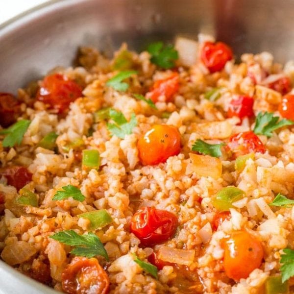 Cauliflower Mexican Rice, a low carb spin on a classic recipe, also known as Spanish Cauliflower Rice, easy paleo, low carb, whole30 side dish recipe you’ll love! | www.noshtastic.com | #lowcarb #keto #paleo #cauliflowerrice #mexicanrice #spanishrice #whole30 #w30 #glutenfree #noshtastic #glutenfreerecipe